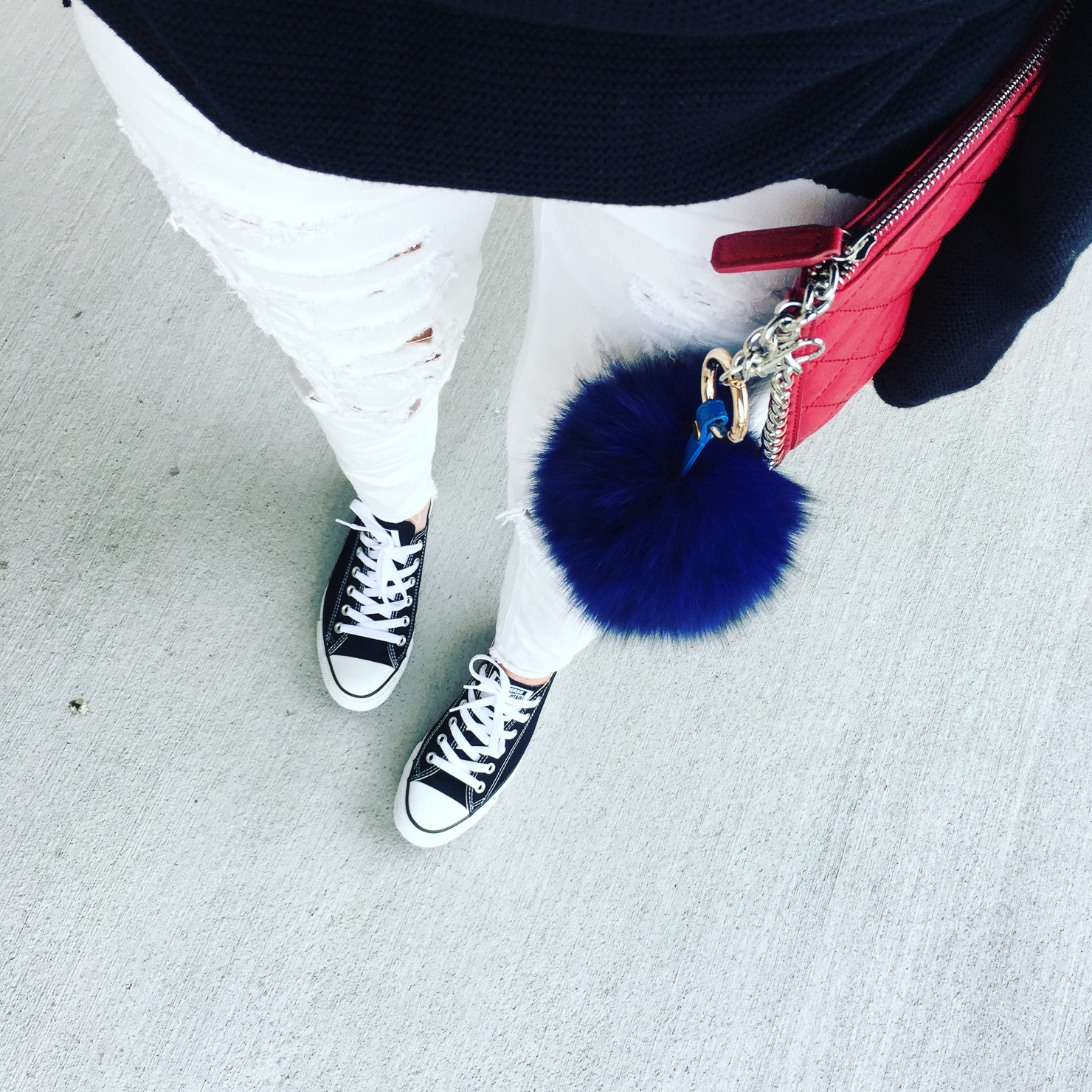 white distressed jeans, black converse, black chucks, blue fur bag pompom, red chanel look for less