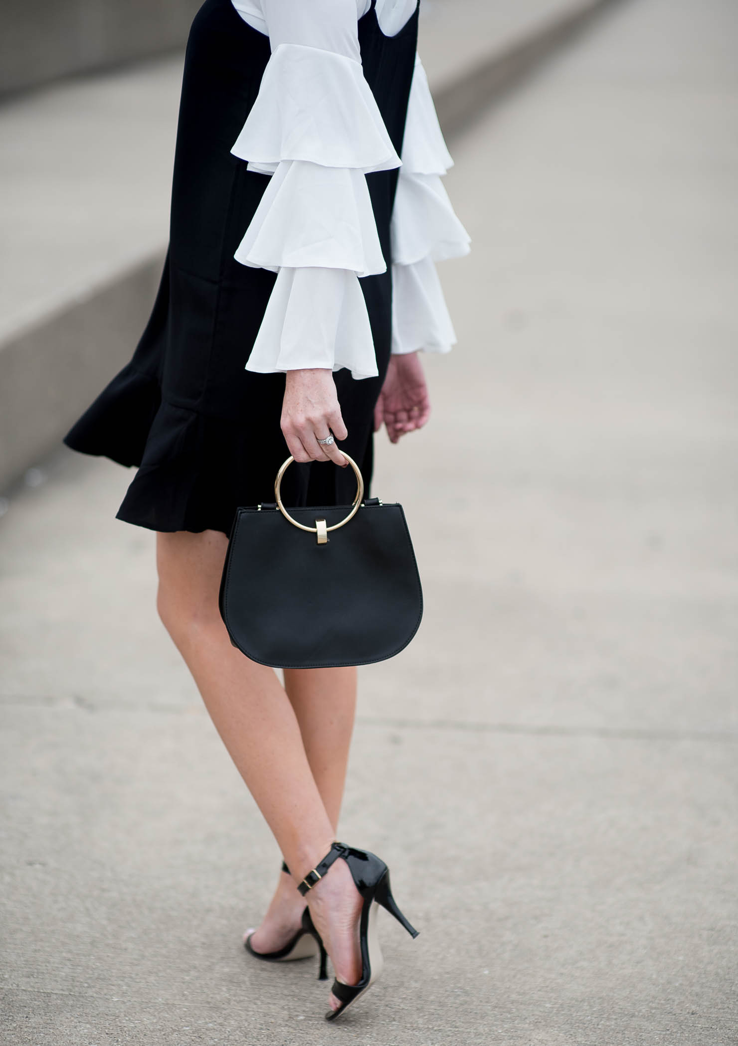 boohoo-ruffle-sleeve-blouse-asos-slip-dress-layered-ruffles-forever-21-round-handle-bag-black-and-cream