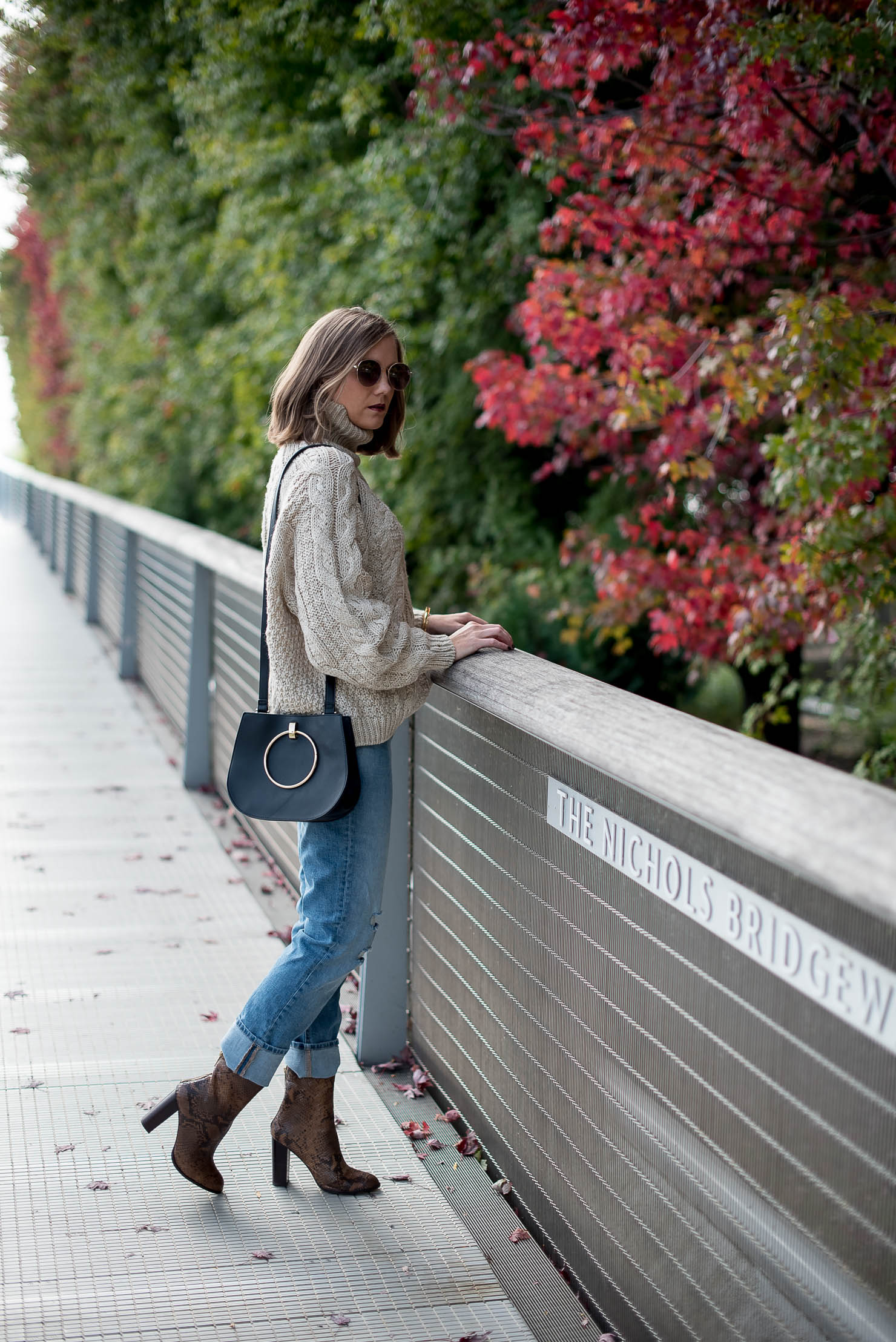 thanksgiving outfit idea fall in chicago hm cable oversized turtleneck sweater girlfriend jeans snakeskin boots how to wear over the ankle boots cozy fall style