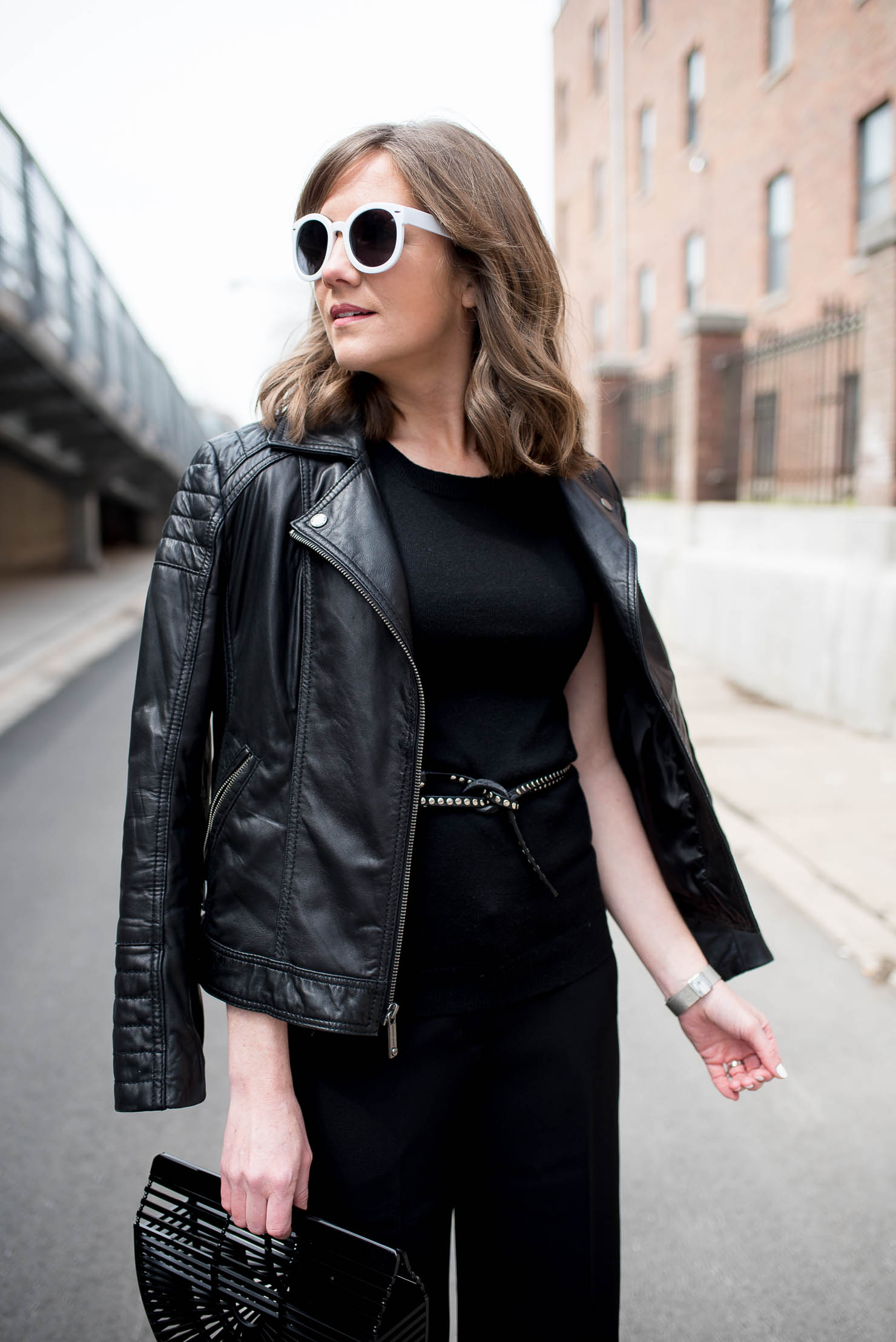 how to style black crop pants, culotte outfit idea, edgy spring outfit, black cult gaia arc clutch, the studded skinny belt, monochromatic outfit