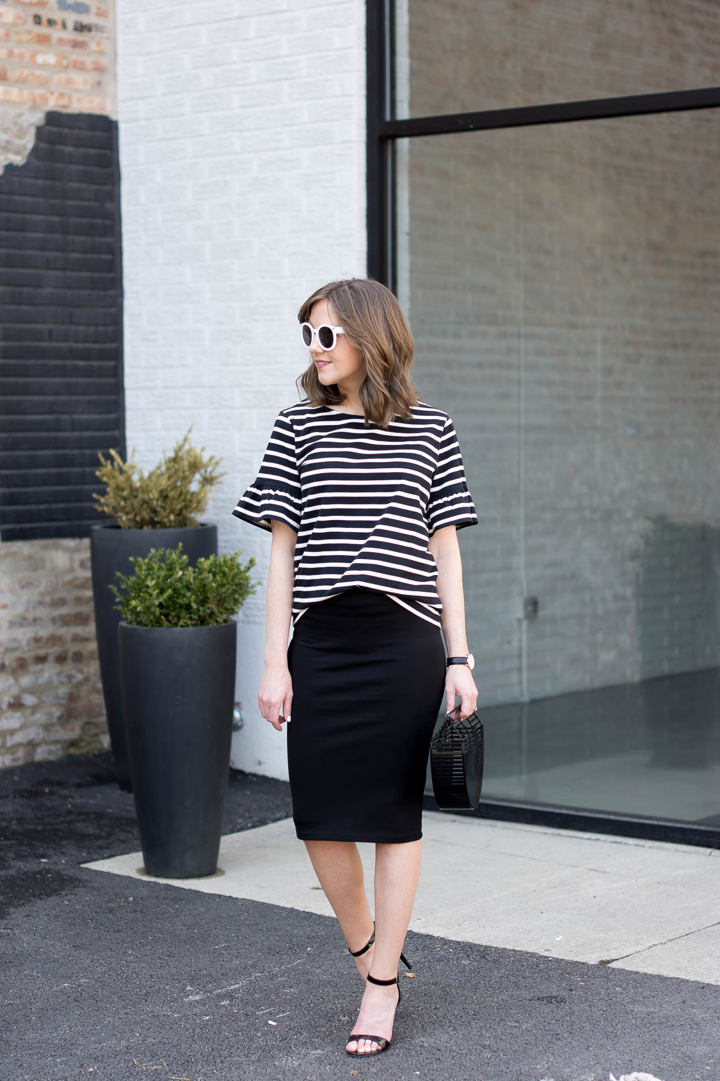 j crew black and white stripe ruffle sleeve tee, black zara pencil skirt, black acrylic cult gaia bag, white round sunnies, celine sunglasses dupe, black and white outfit