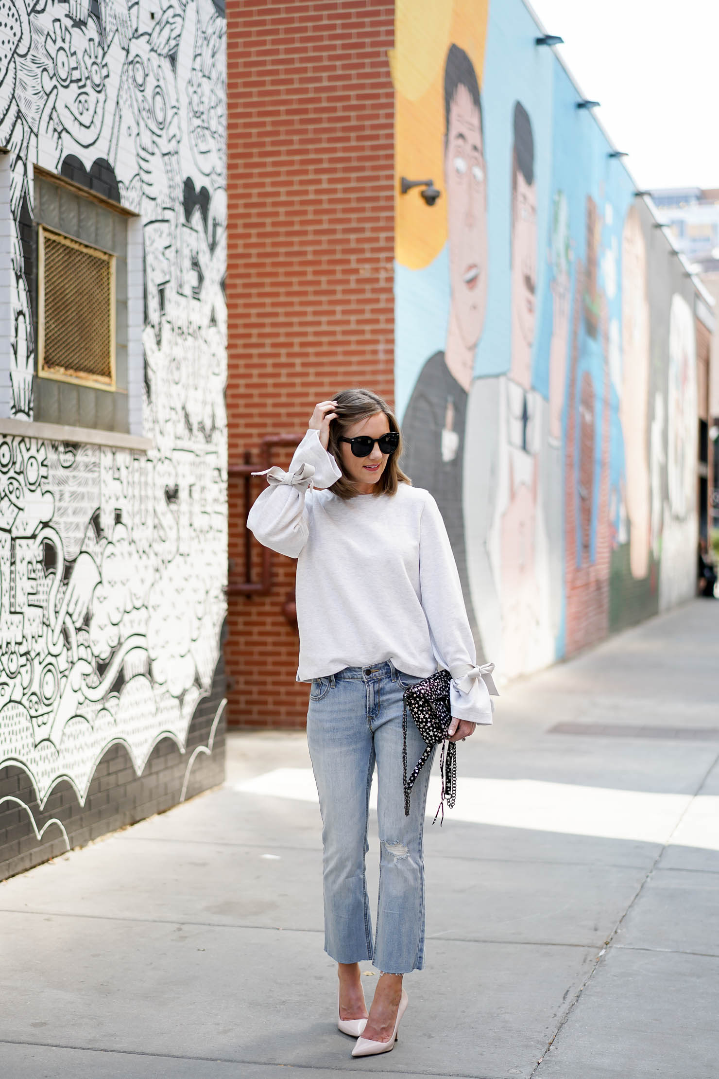J. Crew tie sleeve sweatshirt, rebecca minkoff star print purse, chicago wall art chicago murals, casual yet chic outfit, how to style crop flares, sweatshirt trends