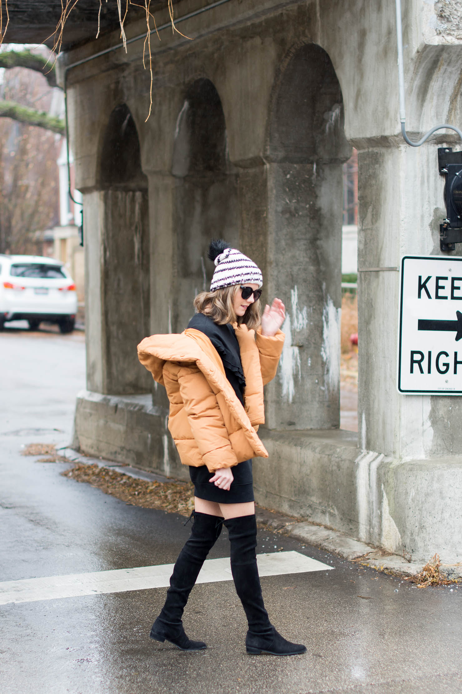 H&M mustard puffer coat, an updated puffer coat, looking cute in a puffer coat, how to style over the knee boots at midlife, a ruffled sweatshirt dress