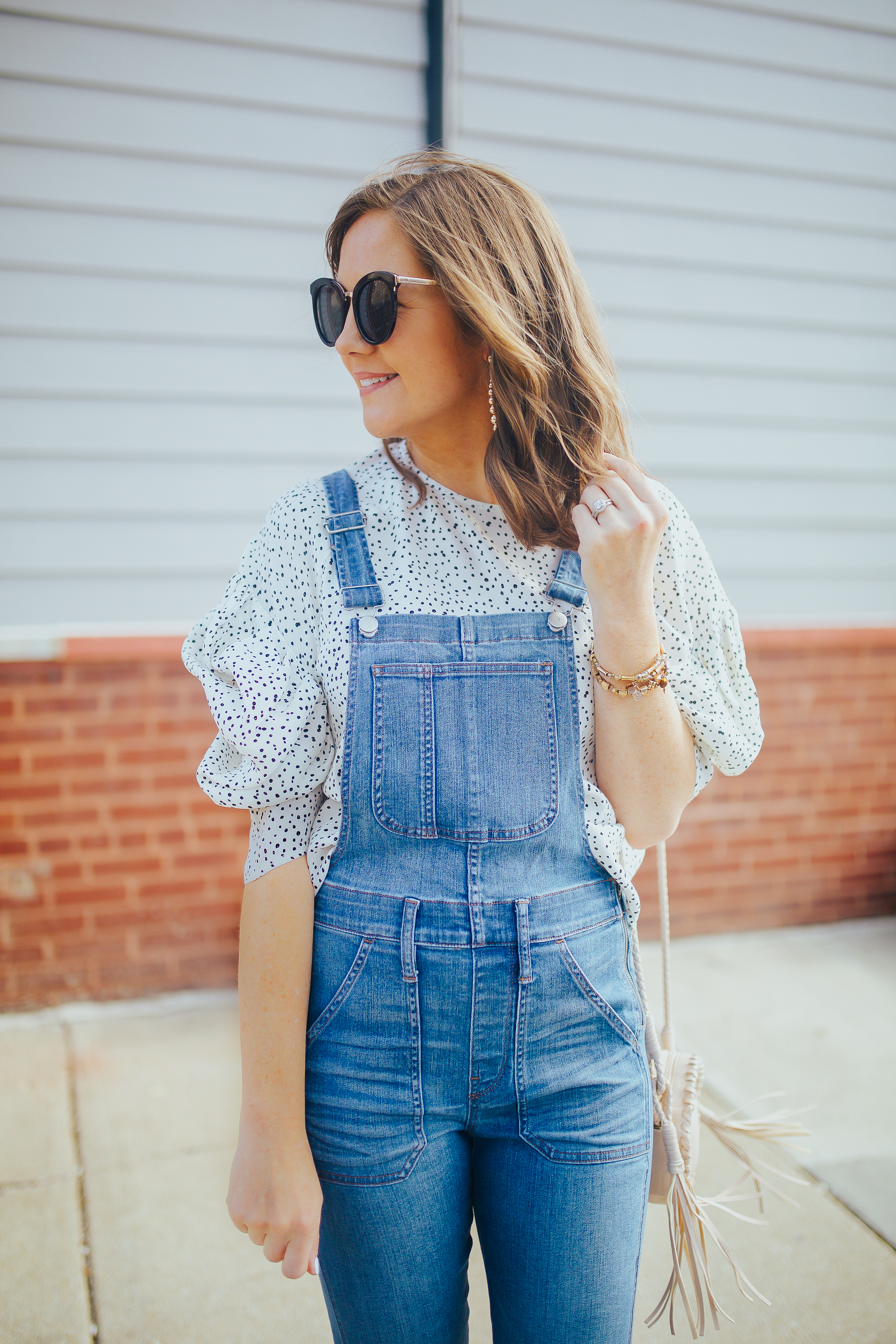 anyone can wear overalls, how to dress up overalls, skinny overalls and a bloused top, polka dot blouse, overalls that flatter every body type